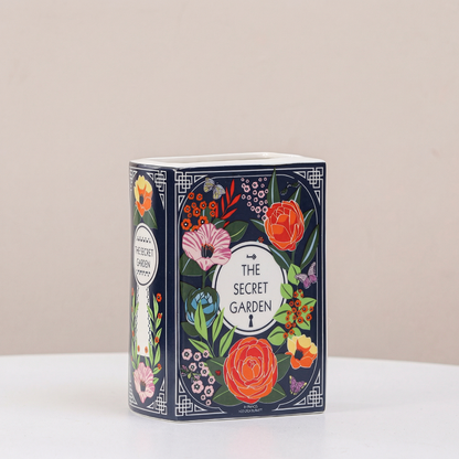 Vase céramique forme livre motif fleurs