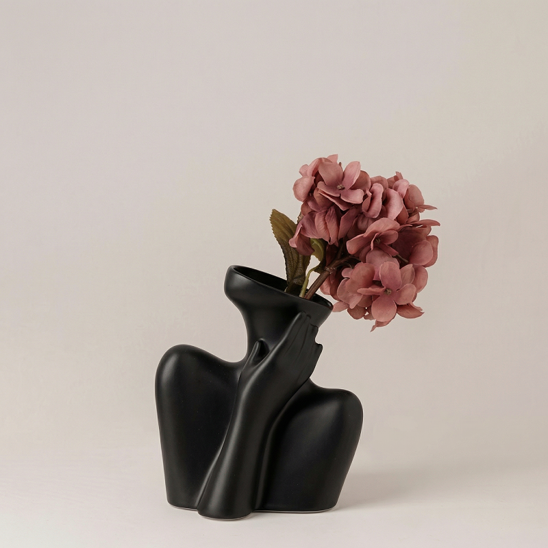 Vase céramique noir buste femme avec hortensia
